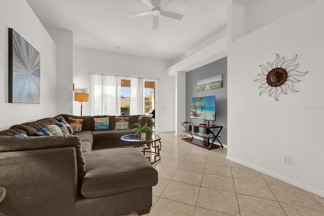 living room with ceiling fan and light tile patterned floors