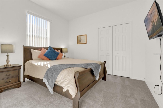 carpeted bedroom featuring a closet