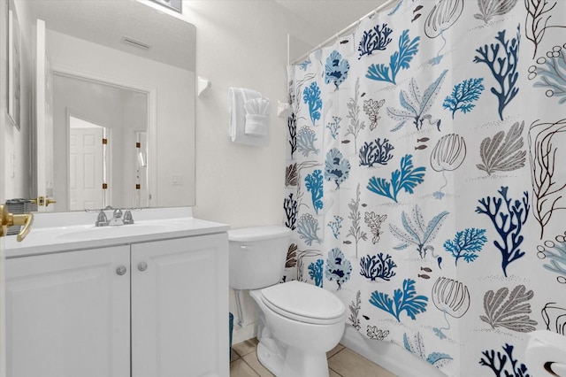 full bathroom with vanity, shower / bathtub combination with curtain, toilet, and tile patterned flooring