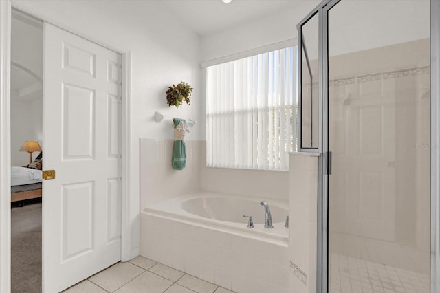 bathroom featuring tile patterned floors and plus walk in shower