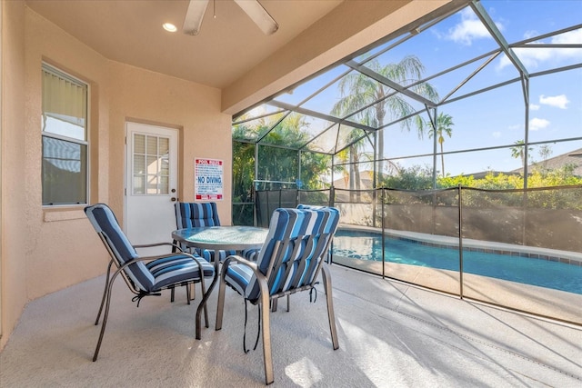 view of patio / terrace featuring a fenced in pool, a lanai, and ceiling fan