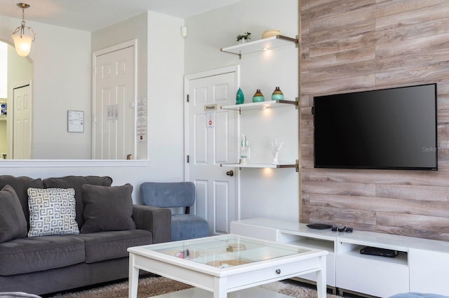 living room featuring wooden walls