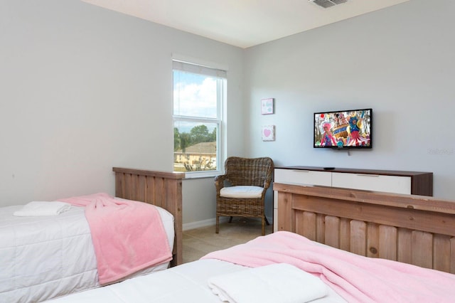 bedroom with light carpet