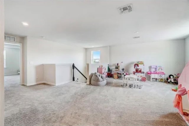 playroom featuring light colored carpet