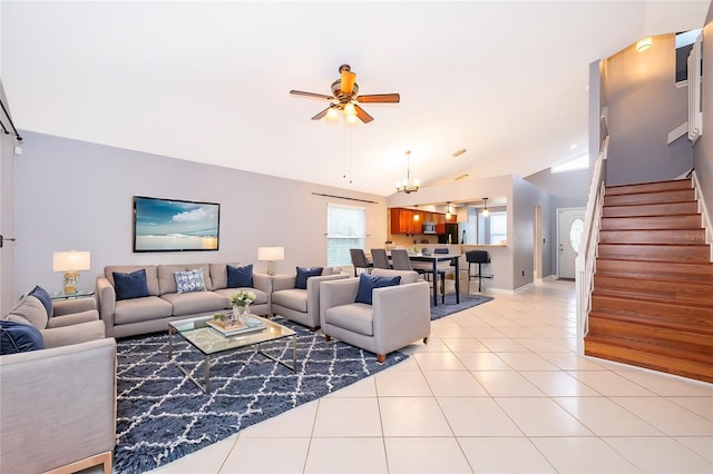 living room featuring vaulted ceiling, ceiling fan with notable chandelier, and light tile patterned floors