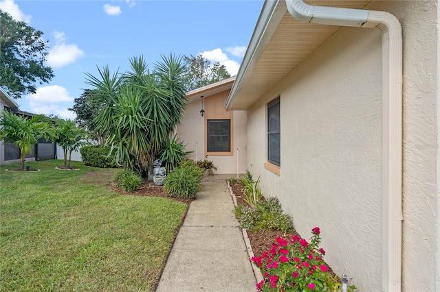 view of side of property with a yard