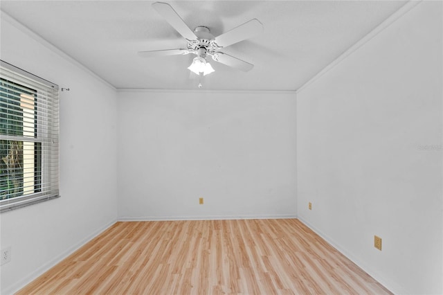 empty room featuring ornamental molding, light hardwood / wood-style flooring, and ceiling fan