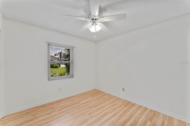 unfurnished room with light hardwood / wood-style flooring, ceiling fan, and crown molding