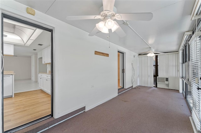 spare room featuring wood-type flooring and ceiling fan