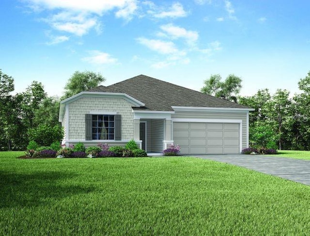 view of front of property with a garage and a front lawn