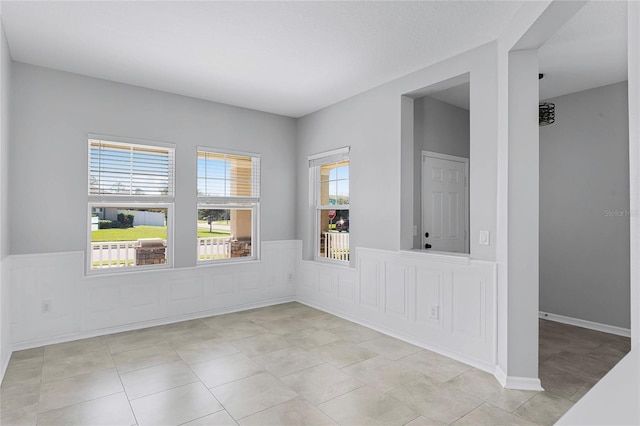 empty room with light tile patterned flooring