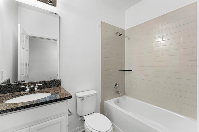 full bathroom with toilet, tiled shower / bath combo, and vanity