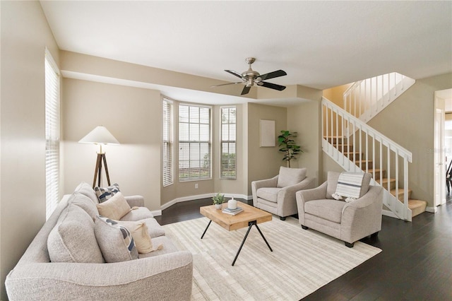 living room with wood-type flooring and ceiling fan