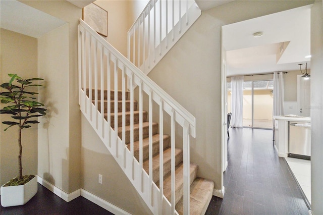 stairway featuring hardwood / wood-style flooring