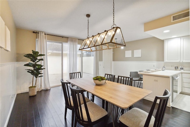 dining area featuring dark hardwood / wood-style floors