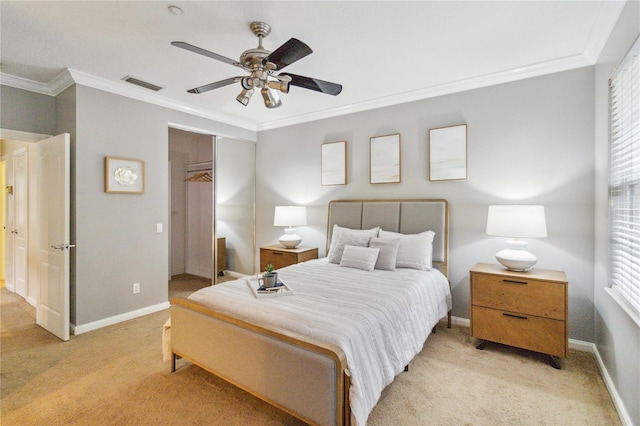 carpeted bedroom featuring crown molding, multiple windows, a closet, and ceiling fan