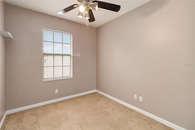 empty room featuring light carpet and ceiling fan