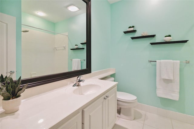 bathroom featuring vanity, toilet, a shower, and tile patterned flooring