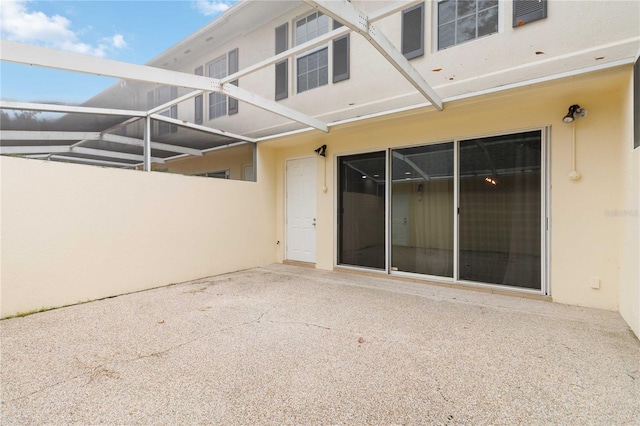 doorway to property featuring a patio