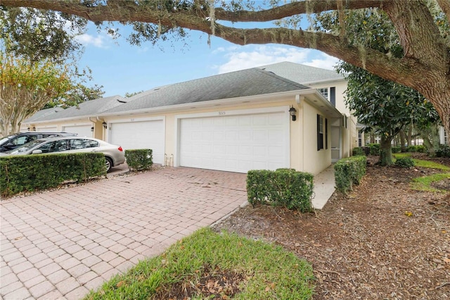 view of side of home featuring a garage