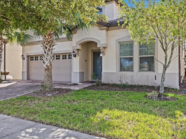 mediterranean / spanish home with a front yard