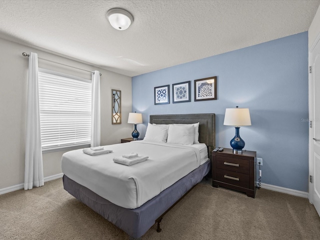 carpeted bedroom featuring a textured ceiling