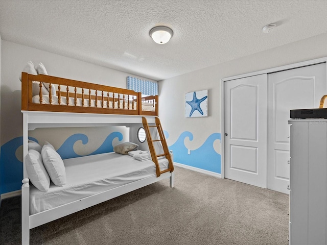 8832 Macapa Dr, Kissimmee, FL 34747 - bedroom with carpet flooring, a textured ceiling, baseboards, and a closet