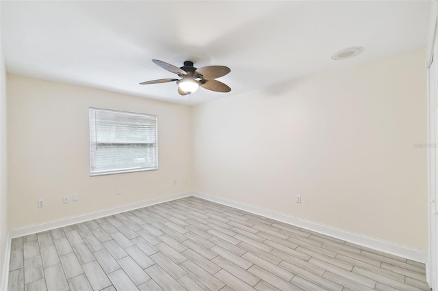 unfurnished room with light wood-type flooring and ceiling fan