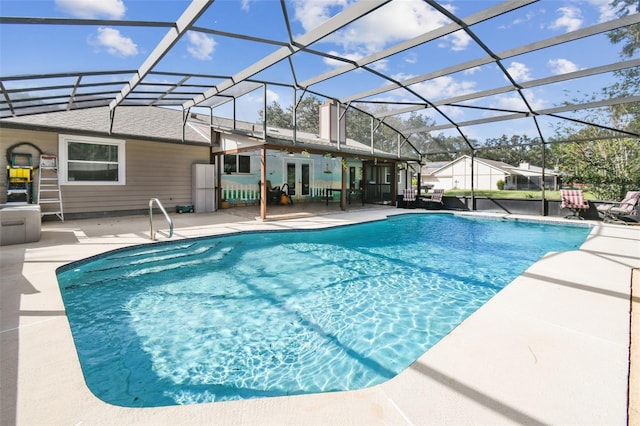 view of pool with a patio area, french doors, and glass enclosure