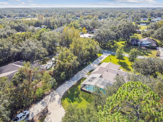 drone / aerial view featuring a view of trees