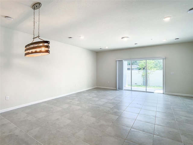 spare room with light tile patterned floors