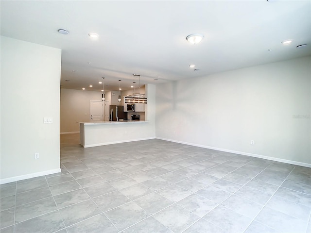 unfurnished living room with light tile patterned flooring