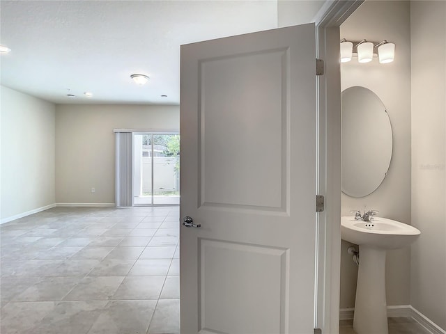 bathroom featuring sink and tile patterned flooring