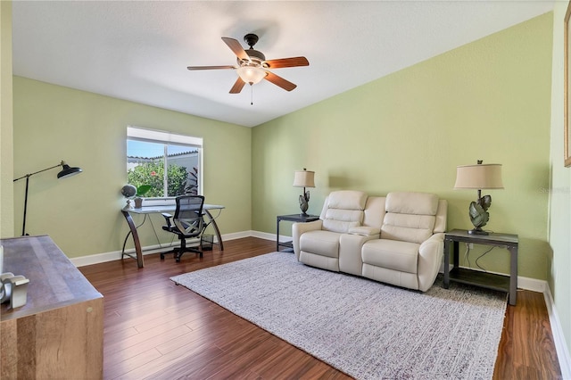 living room featuring ceiling fan and dark hardwood / wood-style floors