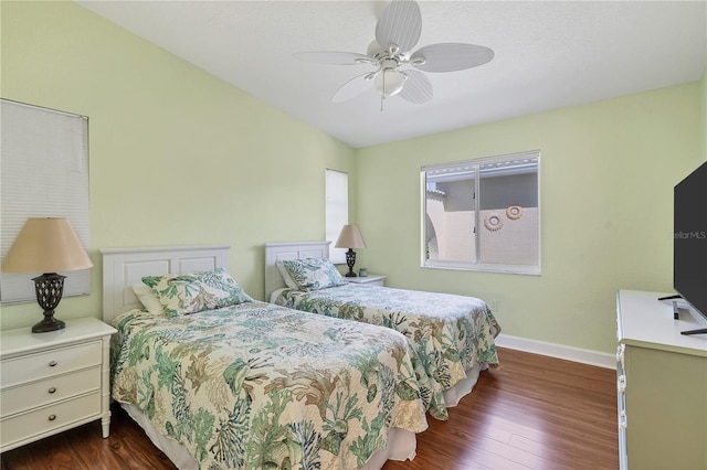 bedroom featuring ceiling fan and dark hardwood / wood-style floors