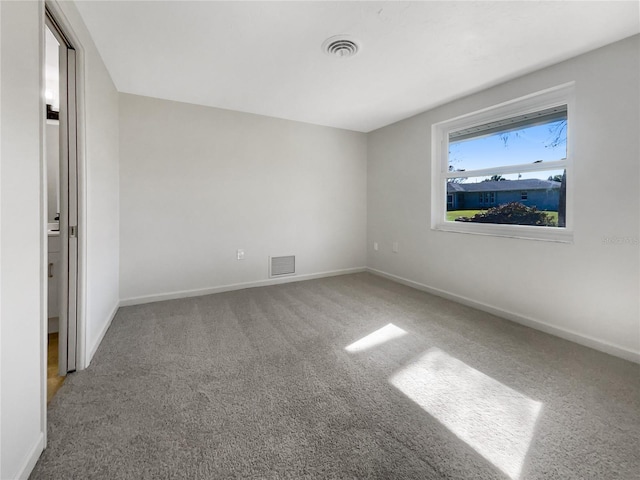 unfurnished room with carpet flooring