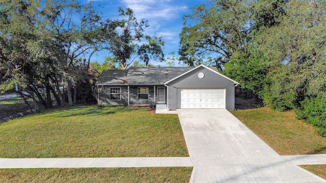 single story home with a garage and a front lawn