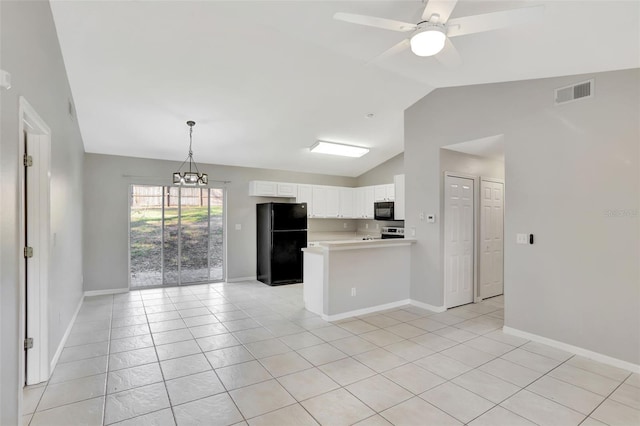 kitchen featuring white cabinetry, vaulted ceiling, light tile patterned flooring, black appliances, and ceiling fan with notable chandelier