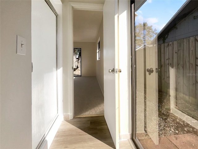 hall with light wood-type flooring