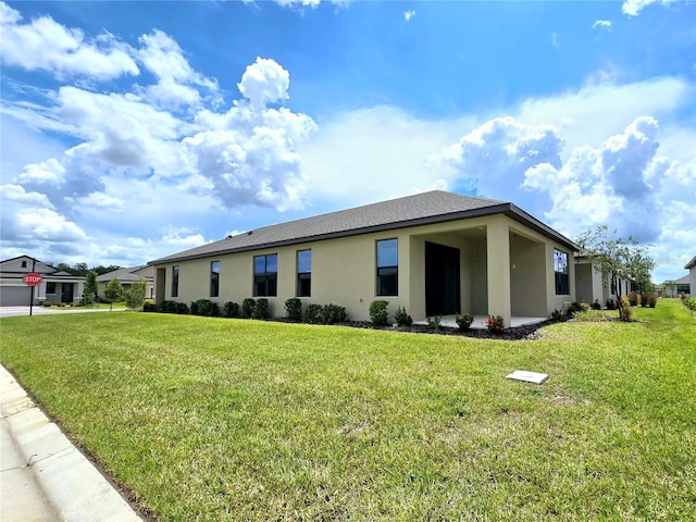 view of side of home featuring a yard