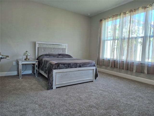 carpeted bedroom with a fireplace