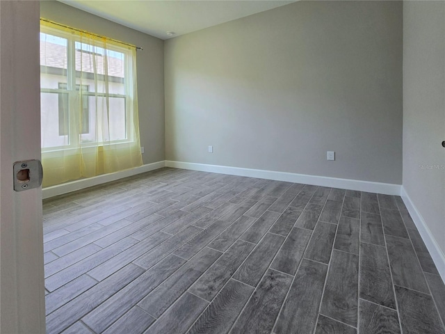 unfurnished room featuring dark hardwood / wood-style floors