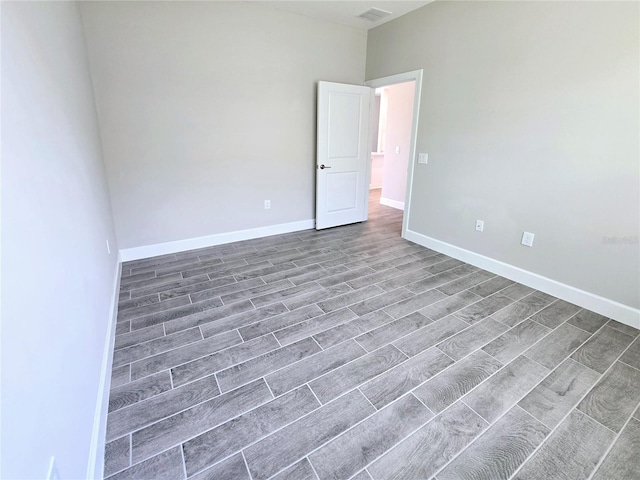 empty room featuring hardwood / wood-style flooring