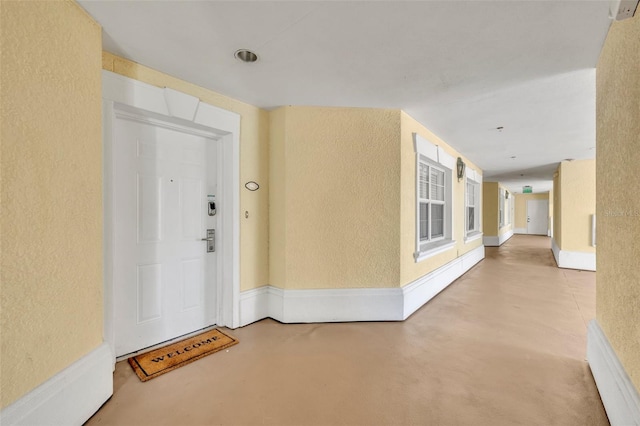 hallway featuring concrete floors