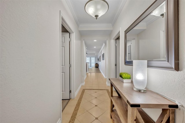 hallway featuring crown molding and light tile patterned floors