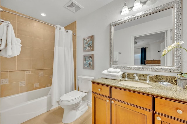 full bathroom featuring tile patterned floors, shower / bathtub combination with curtain, toilet, vanity, and ceiling fan