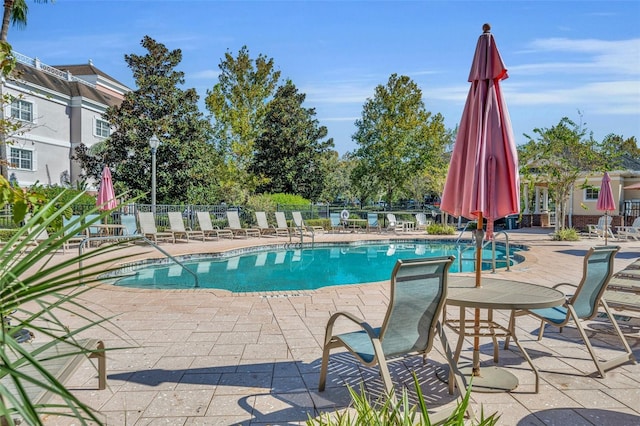 view of swimming pool featuring a patio