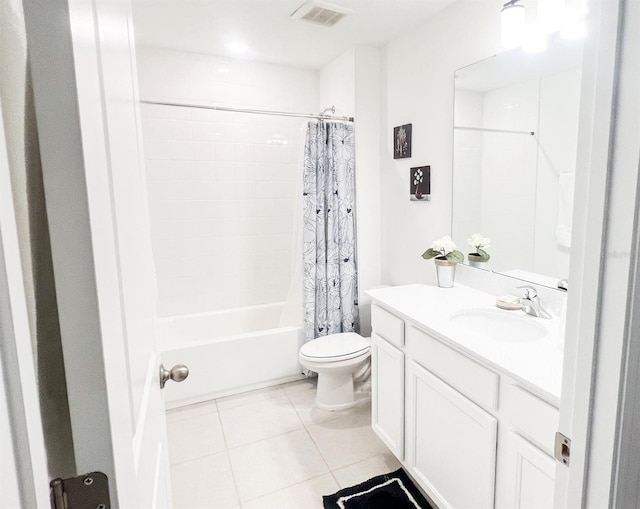 full bathroom featuring vanity, shower / bath combo with shower curtain, toilet, and tile patterned flooring