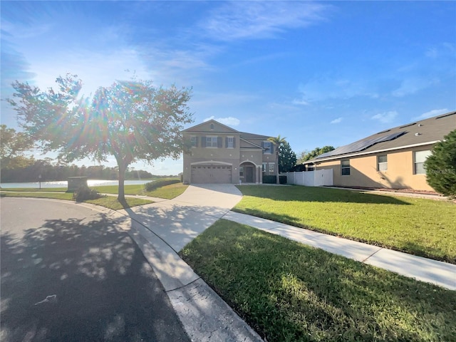 view of front facade featuring a front lawn and a garage