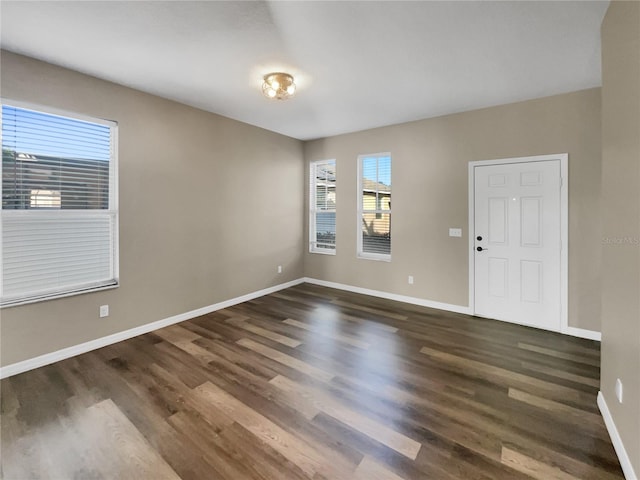 spare room featuring dark hardwood / wood-style floors